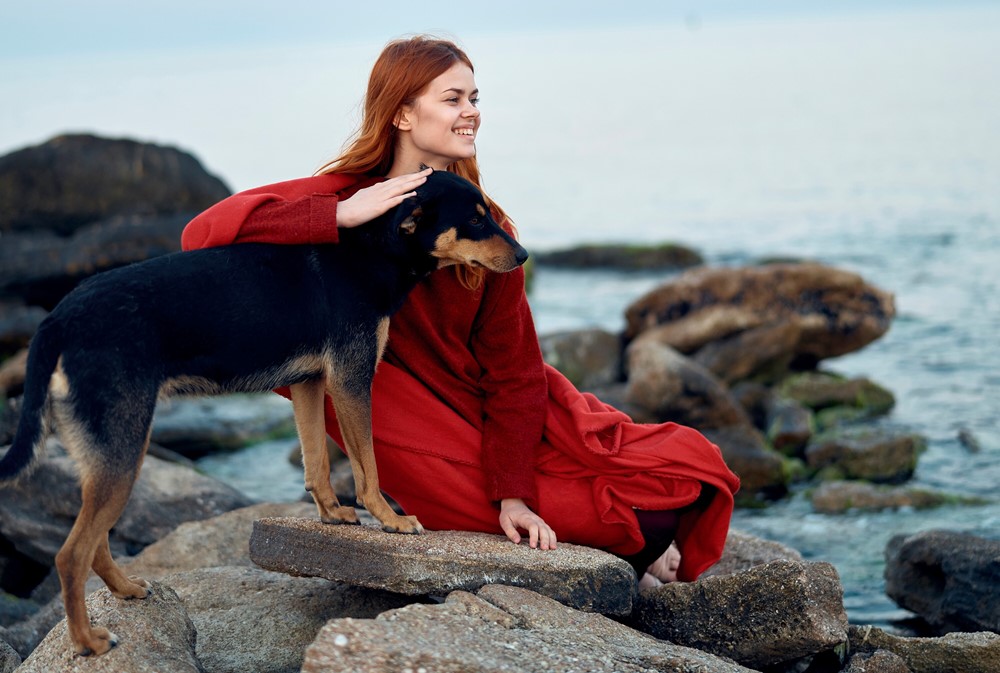 girl on beach with dog 1