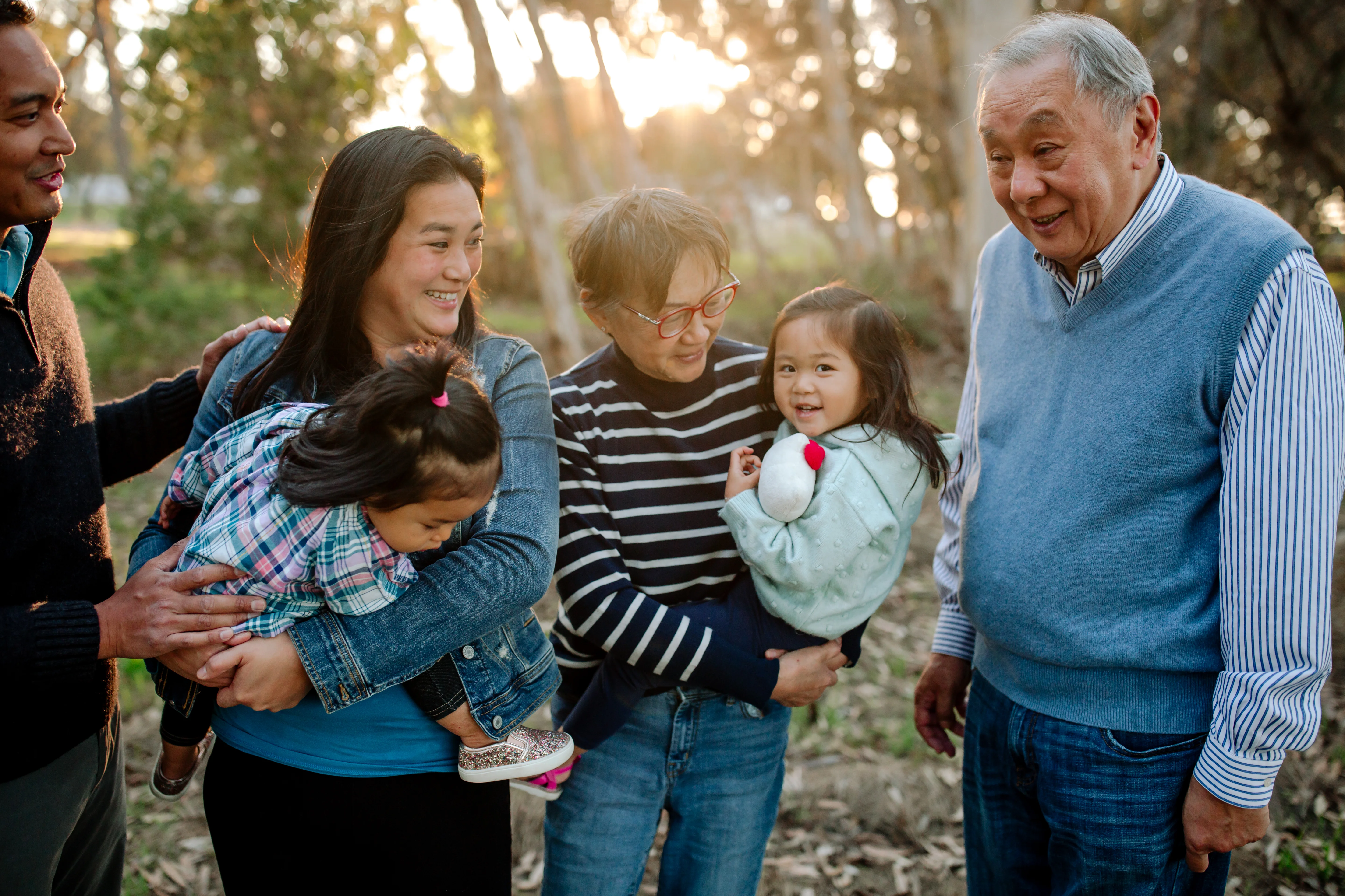 a group of people holding a baby